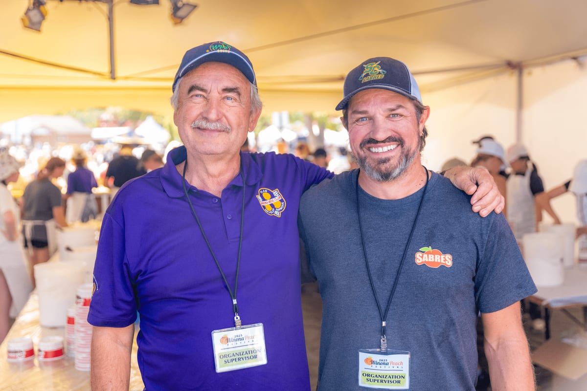 Two volunteers at the Winona Peach Festival